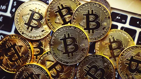 Bitcoin a rupt pragul de 100.000 de dolari, pentru prima dată din februarie. Ce mișcări de pe piața internațională au determinat aceată performanță